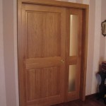 Porte coulissante interieure, avec partie fixe et habillages en chêne